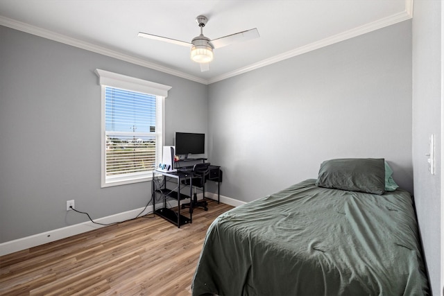 1623 Bay Meadows St, Galveston, TX 77554 - bedroom featuring a ceiling fan, baseboards, light wood-type flooring, and ornamental molding