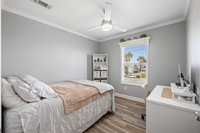 1623 Bay Meadows St, Galveston, TX 77554 - bedroom with visible vents, crown molding, ceiling fan, baseboards, and wood finished floors