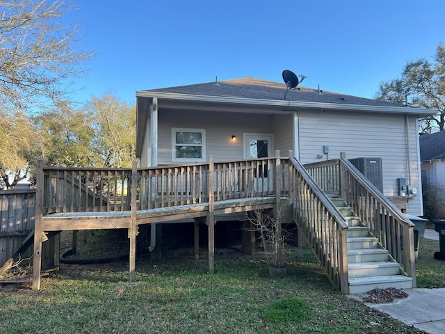 back of property with a wooden deck