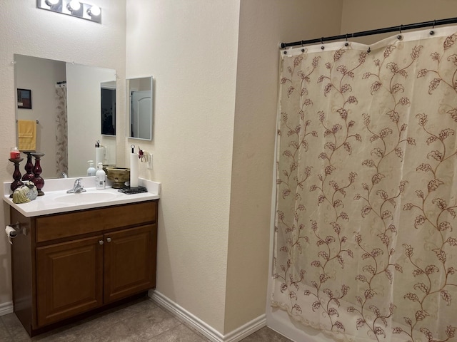 bathroom featuring vanity, tile patterned flooring, and shower / bath combination with curtain