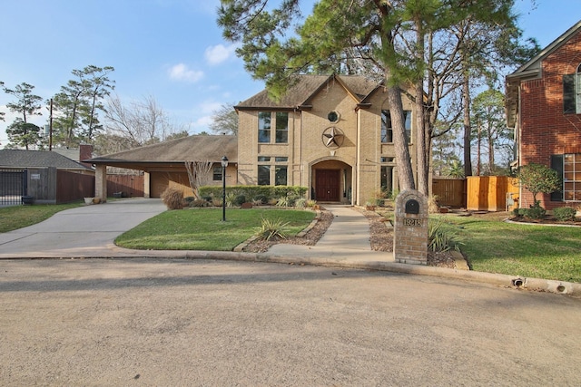 view of front of property featuring a front lawn and a carport