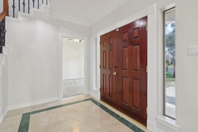 foyer featuring crown molding