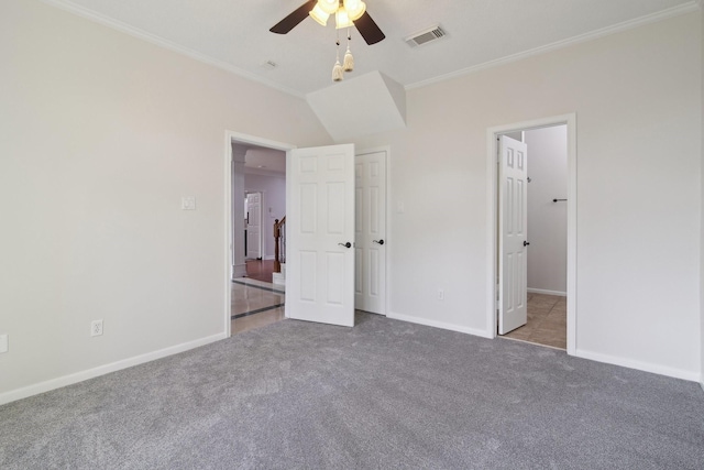 unfurnished bedroom with ornamental molding, light carpet, and ceiling fan