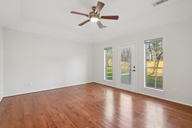 empty room featuring hardwood / wood-style flooring and ceiling fan