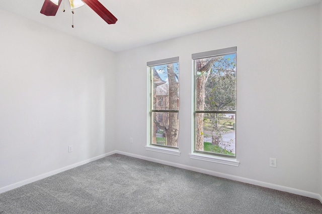 spare room with ceiling fan and carpet floors