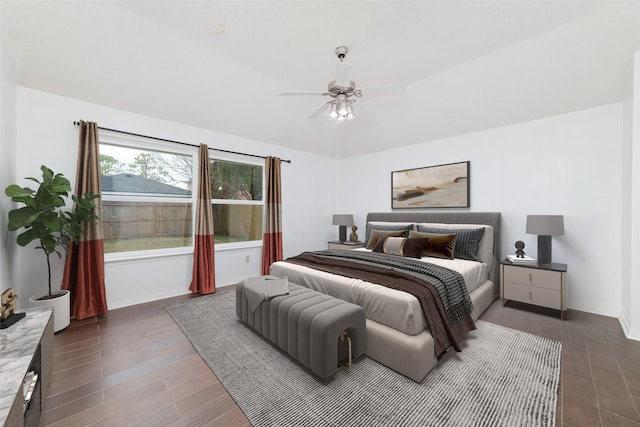 bedroom with ceiling fan and dark hardwood / wood-style flooring