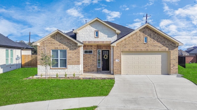 view of front of home featuring a garage and a front yard