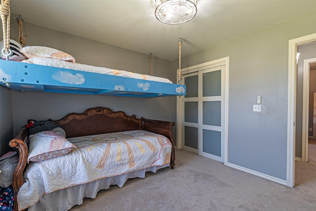 bedroom with carpet and baseboards