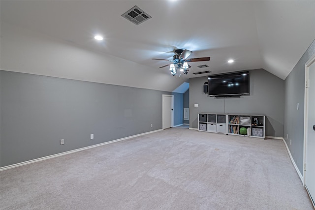 carpeted home theater room with baseboards, visible vents, a ceiling fan, vaulted ceiling, and recessed lighting