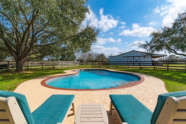 view of swimming pool featuring a fenced in pool, fence, a lawn, and an outdoor structure