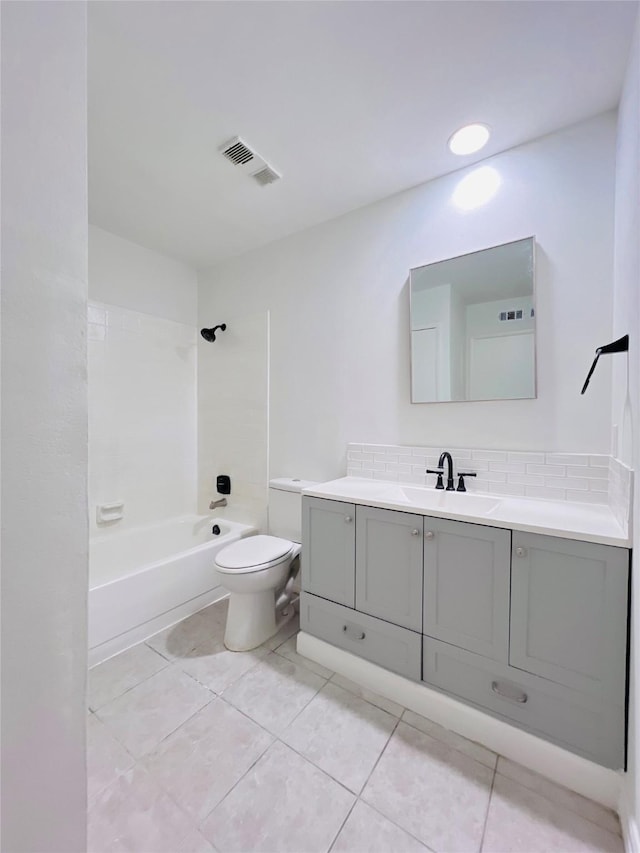 bathroom featuring visible vents, toilet, shower / tub combination, vanity, and backsplash