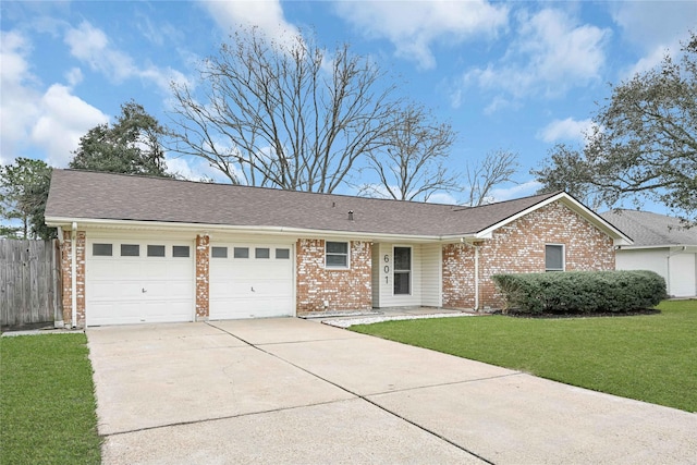 ranch-style home with a front yard and a garage