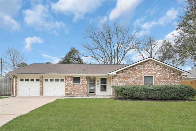 ranch-style home with a front lawn and a garage