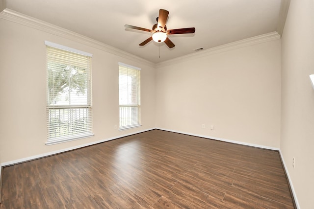 spare room with ornamental molding, dark hardwood / wood-style floors, and ceiling fan