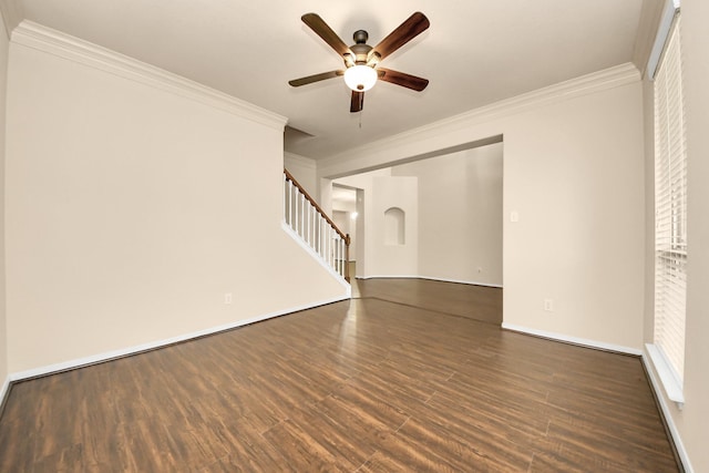 unfurnished living room featuring ornamental molding, dark wood-type flooring, and ceiling fan