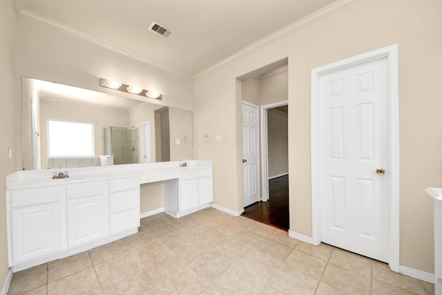 bathroom featuring a shower, tile patterned floors, crown molding, and vanity