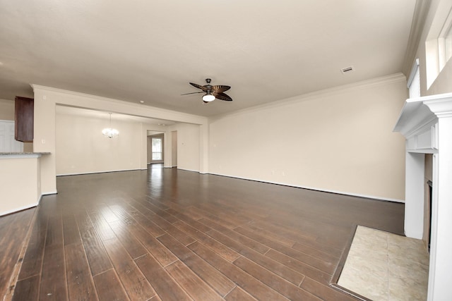 unfurnished living room featuring ceiling fan with notable chandelier, dark hardwood / wood-style flooring, and ornamental molding