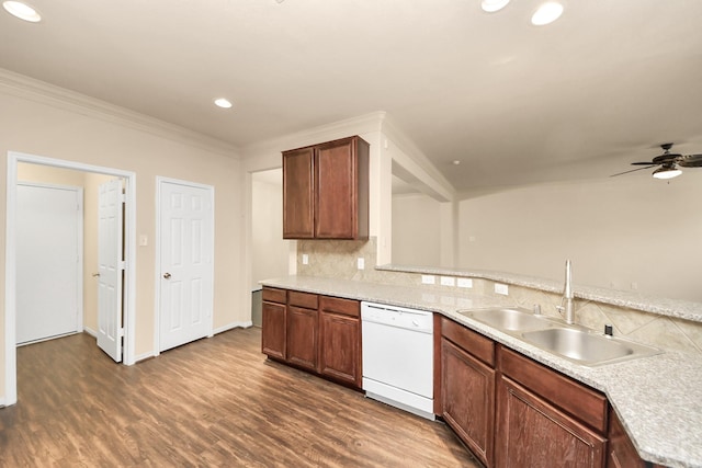 kitchen featuring dishwasher, crown molding, backsplash, dark hardwood / wood-style flooring, and sink