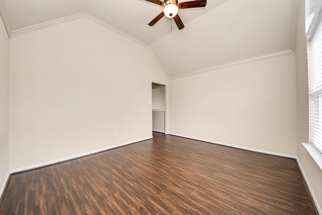 empty room featuring dark hardwood / wood-style flooring, ornamental molding, ceiling fan, and lofted ceiling