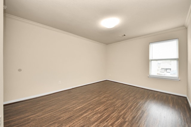 unfurnished room with crown molding and dark hardwood / wood-style flooring