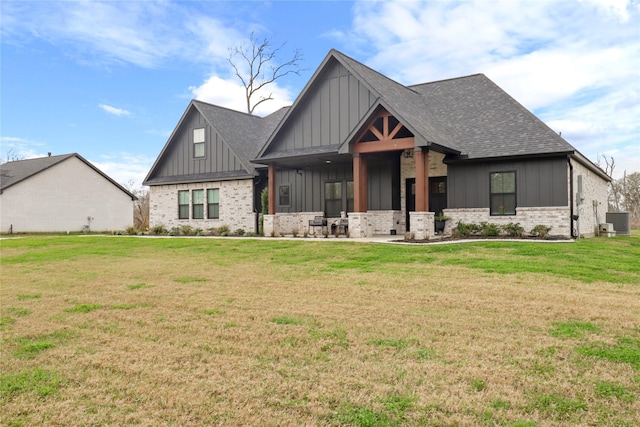 modern inspired farmhouse featuring a shingled roof, central AC unit, a front lawn, board and batten siding, and brick siding