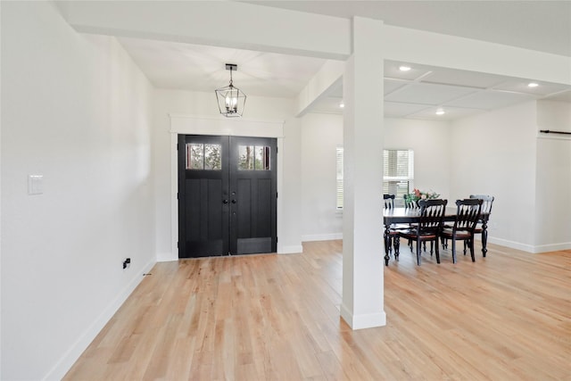 entryway featuring light wood-style floors, recessed lighting, baseboards, and an inviting chandelier