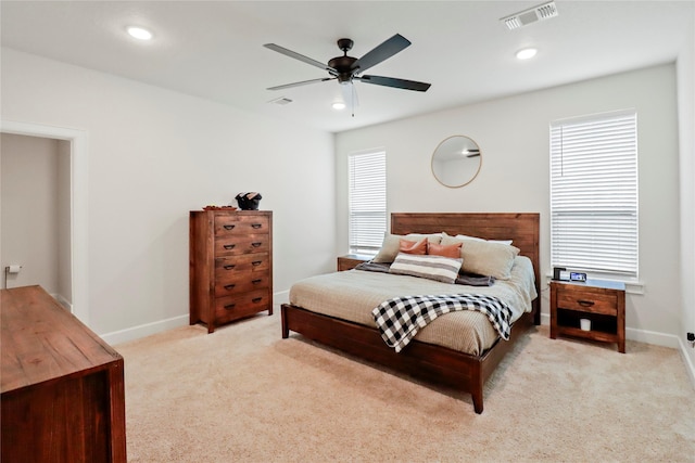 bedroom with light carpet, baseboards, visible vents, and recessed lighting