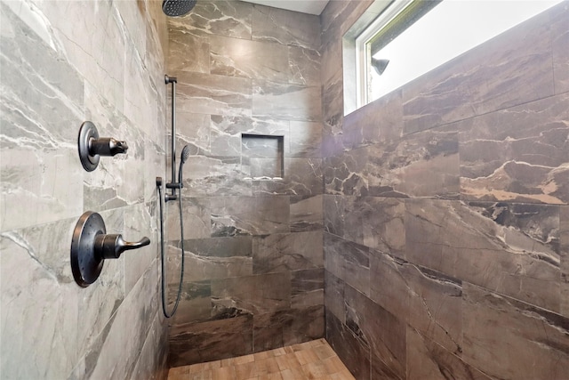 bathroom with tiled shower