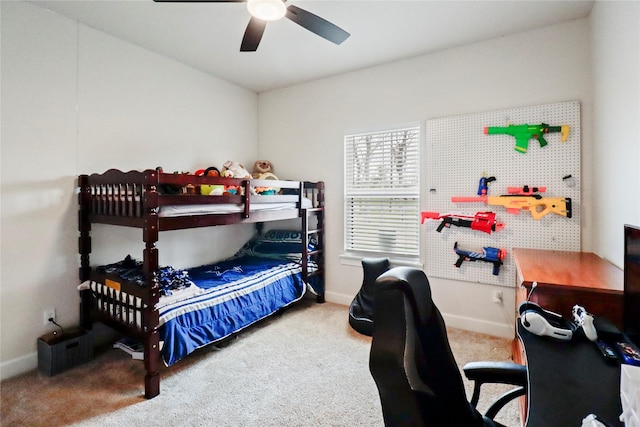 bedroom with carpet, baseboards, and a ceiling fan