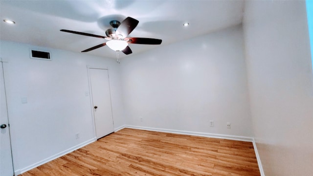 unfurnished room with light hardwood / wood-style flooring and ceiling fan