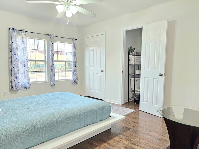 bedroom with ceiling fan and wood finished floors