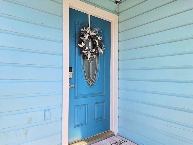 view of exterior entry featuring a garage