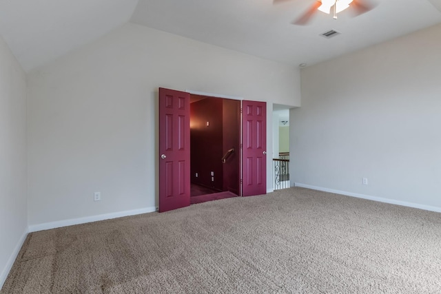 unfurnished bedroom with vaulted ceiling, carpet flooring, and ceiling fan