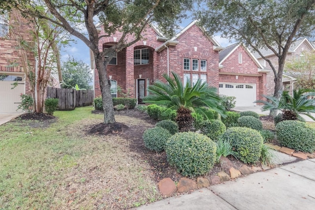 front facade featuring a garage and a front lawn