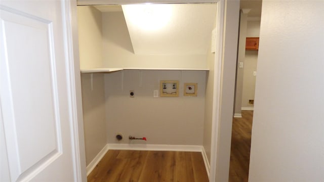 washroom featuring dark wood-type flooring, washer hookup, and gas dryer hookup