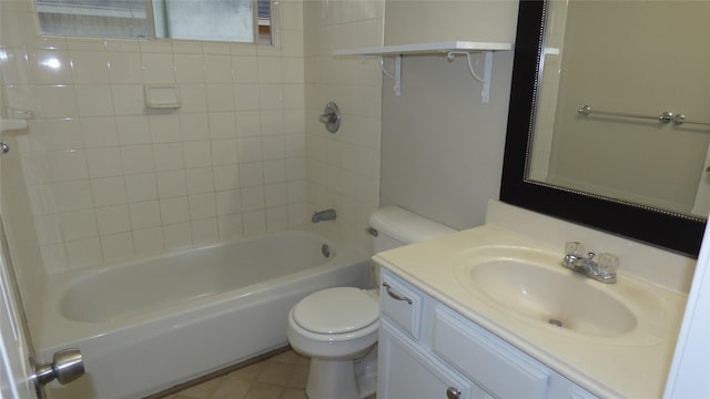 full bathroom with tiled shower / bath combo, vanity, tile patterned flooring, and toilet