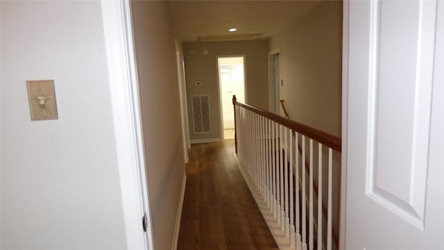 hall with dark wood-type flooring