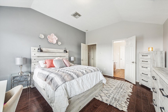 bedroom featuring lofted ceiling and dark wood-type flooring