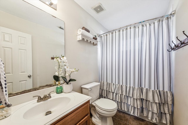 full bathroom with shower / tub combo, toilet, vanity, and tile patterned flooring