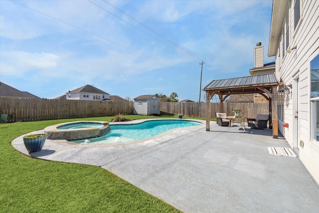 view of swimming pool featuring a yard, an in ground hot tub, a patio area, a shed, and a gazebo