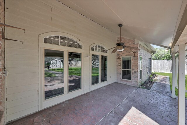 view of patio with a ceiling fan and fence