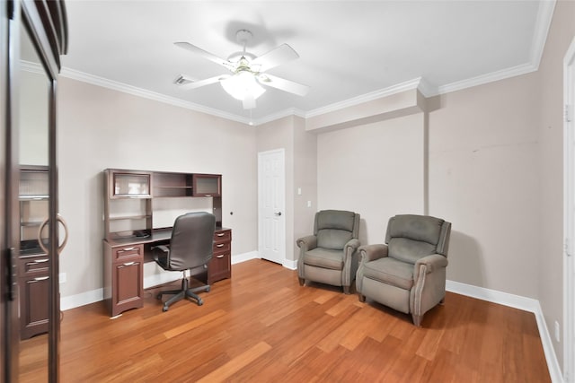 home office with light wood-style flooring, a ceiling fan, crown molding, and baseboards