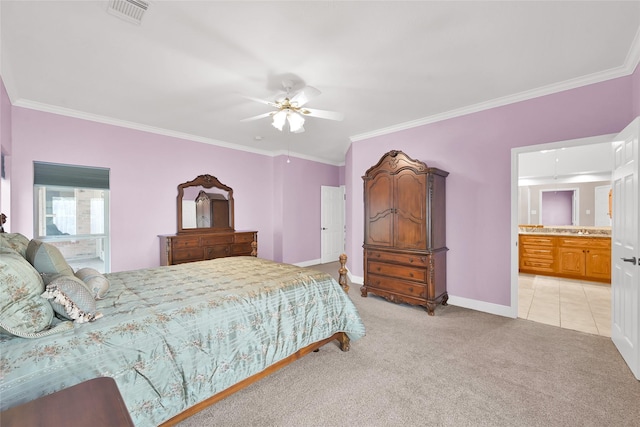 bedroom featuring ornamental molding, light carpet, connected bathroom, and ceiling fan