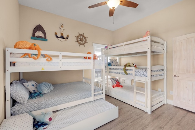 bedroom featuring ceiling fan and wood finished floors