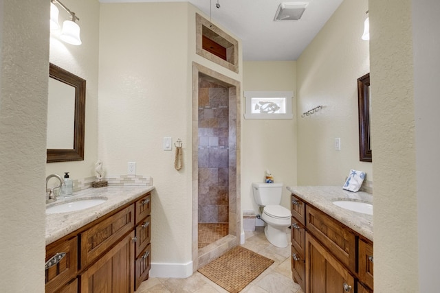 bathroom with two vanities, a sink, toilet, and a shower stall