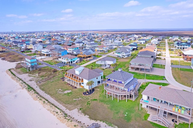 drone / aerial view featuring a water view and a residential view