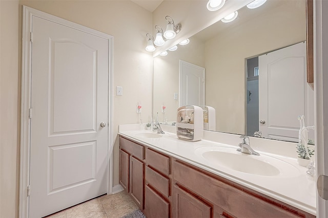 bathroom with tile patterned floors and vanity