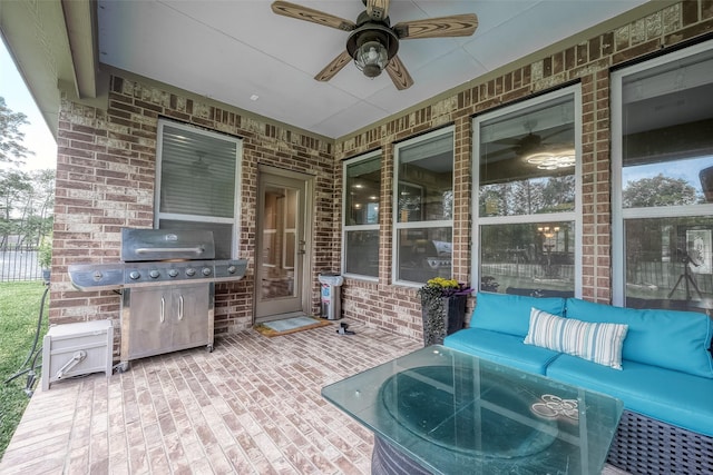 view of patio with ceiling fan and a grill