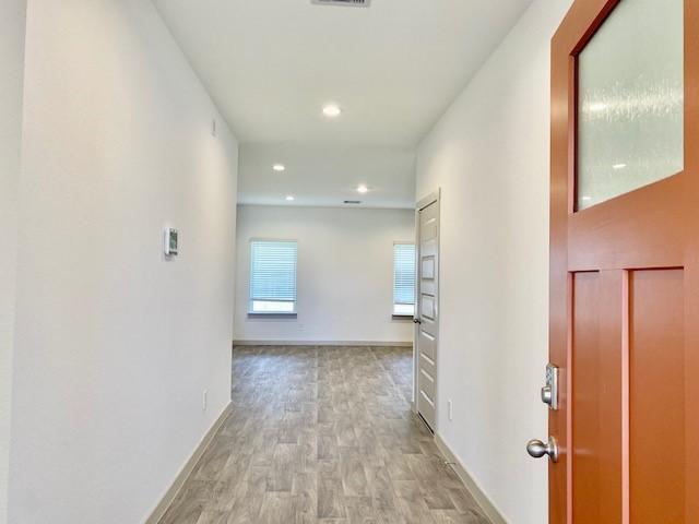 hallway featuring light hardwood / wood-style flooring