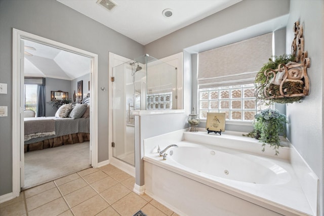 bathroom featuring plus walk in shower, tile patterned flooring, and lofted ceiling